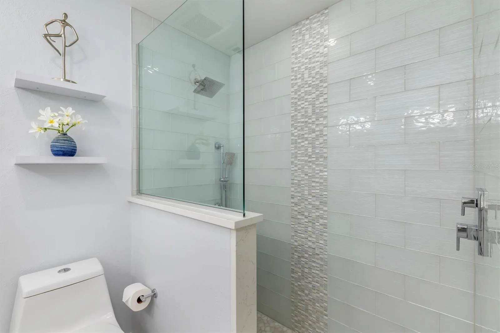 Beautifully tiled and completely updated bathroom.