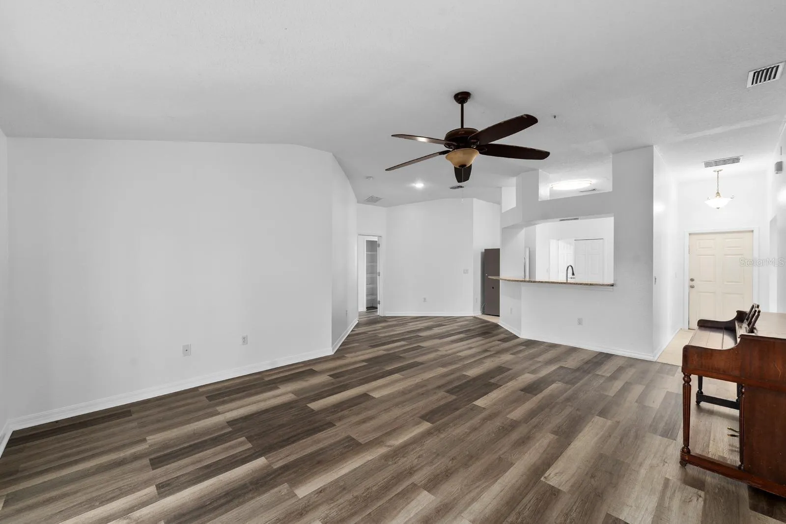 View of Front Door and Kitchen from Living Room
