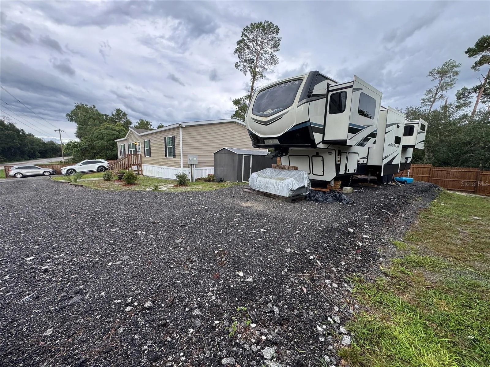 Large compacted pad can accomidate an RV, Boat, Trailer and has a 50 Amp dedicated connection for RV power