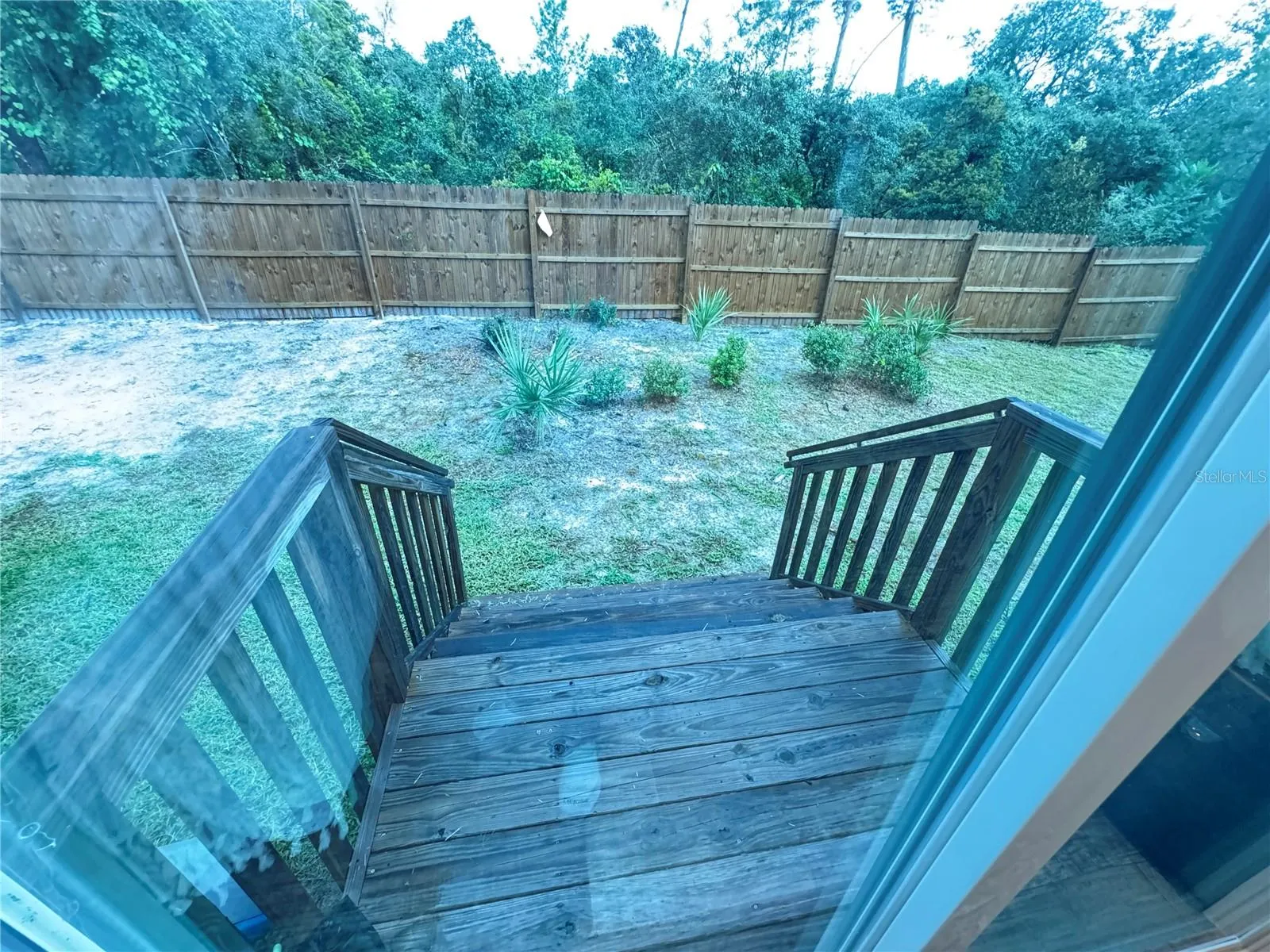 Back porch access to back yard off dining area