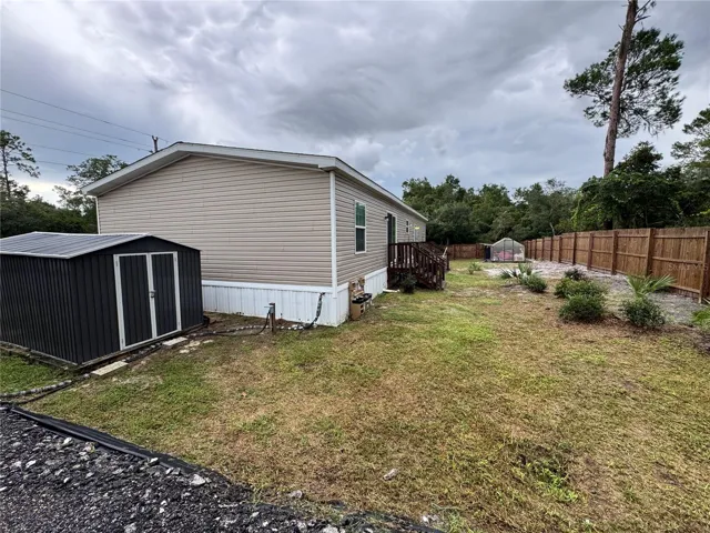 Large double door storage shed and private back yard.