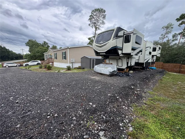 Large compacted pad can accomidate an RV, Boat, Trailer and has a 50 Amp dedicated connection for RV power