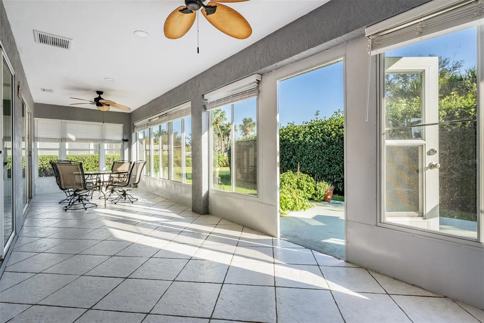 Sunroom is enclosed and runs length of home!