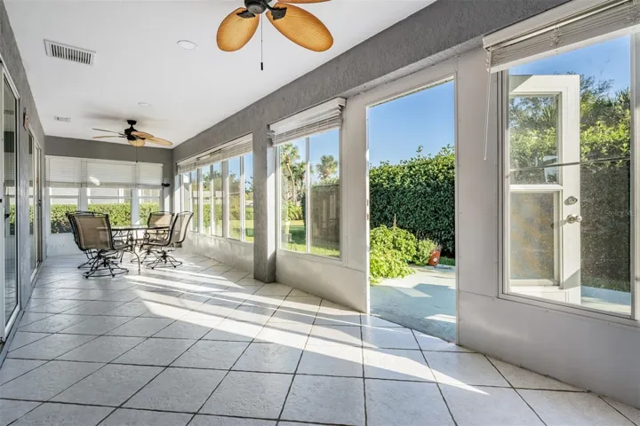Sunroom is enclosed and runs length of home!