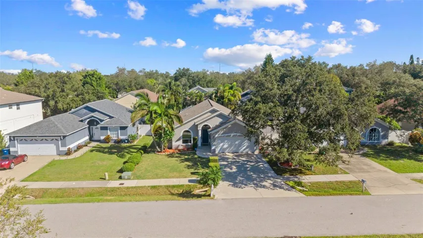 front of home on right under shaded trees