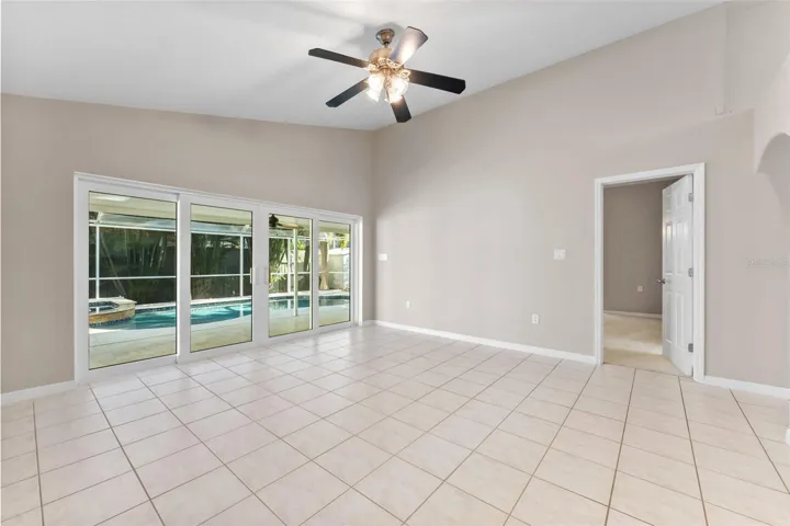 family room with entrance into primary  bedroom
