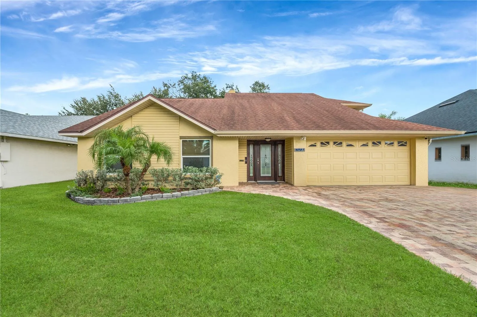 Numerous improvements offer added peace of mind, including impact windows (2018), roof (2018), upgraded A/C (2017), hot water heater (2020), kitchen remodel (2023), second-floor bathroom remodel (2023), upstairs carpet (2023), downstairs carpet (2024), upgraded pool pump (2026), and first-floor toilet replacement (2026). The pool and spa are heated by propane, and the home also features a water softener and security system.