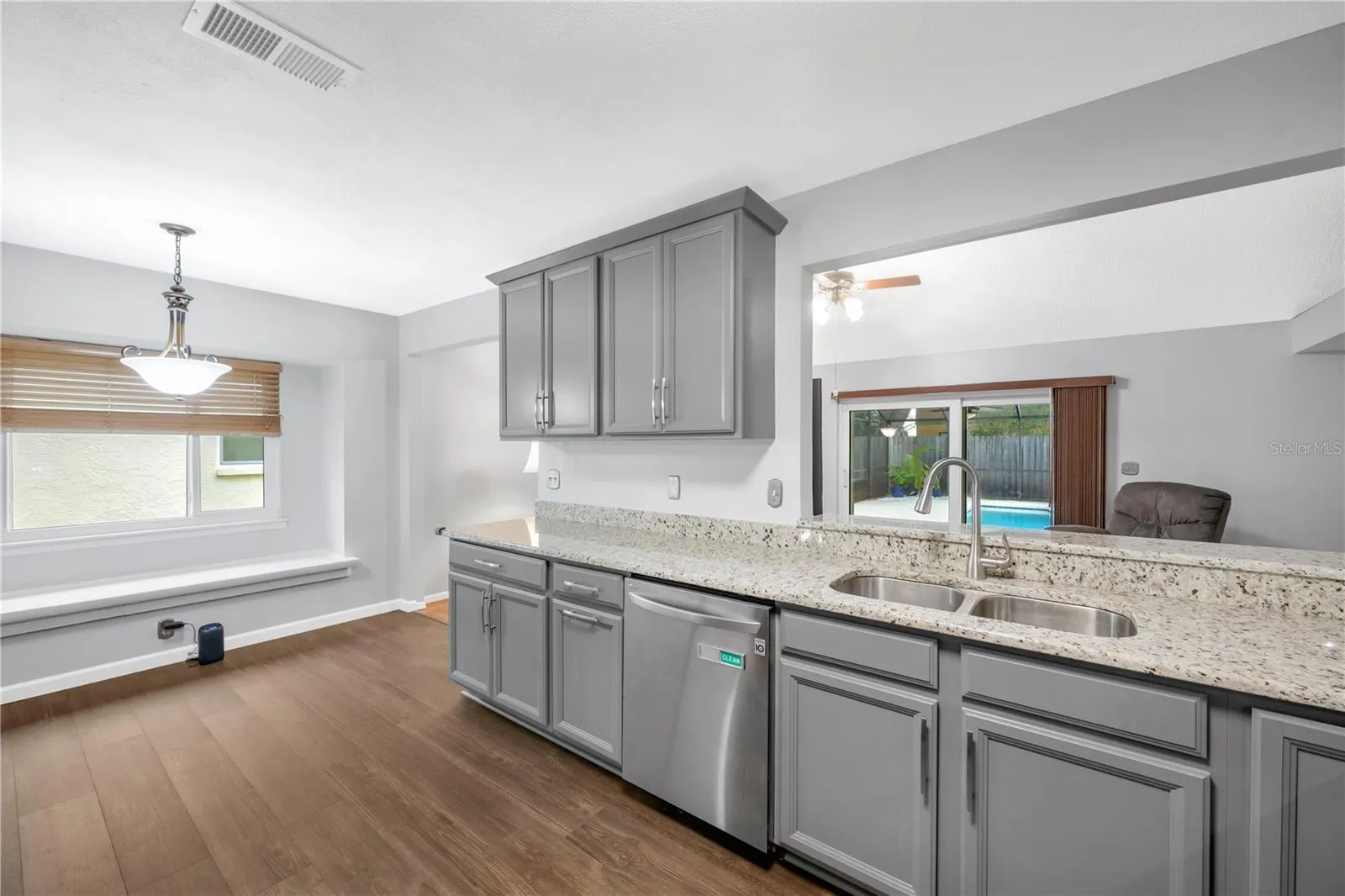 There is a pass through window and breakfast bar for seamless connection between the kitchen and family room.
