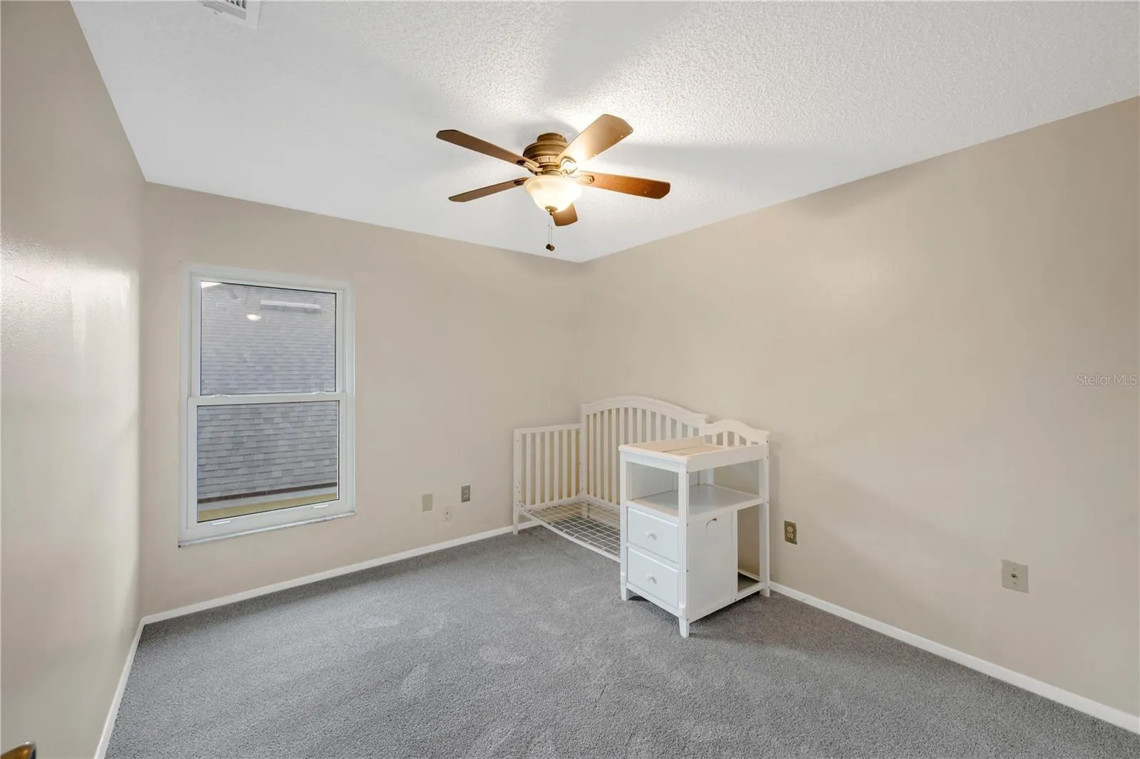 Bedroom #2 Has a walk-in closet, Updated carpet in 2023 and a ceiling fan.