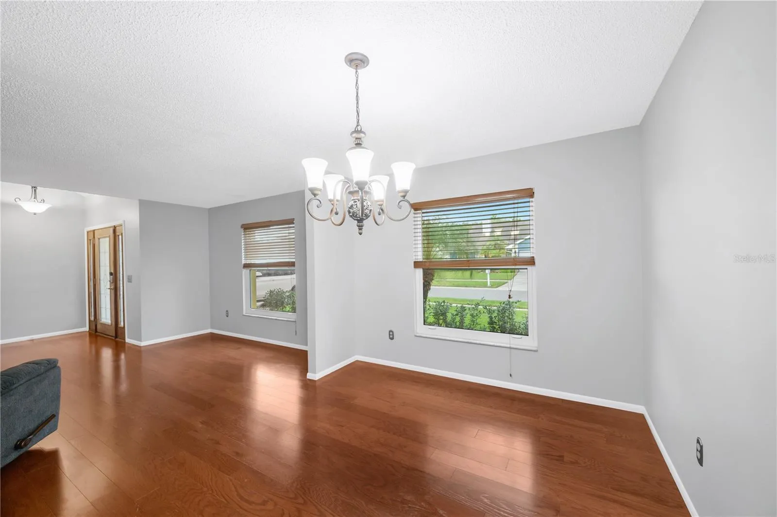 Additional living areas include a living room and a dining room next to the kitchen.