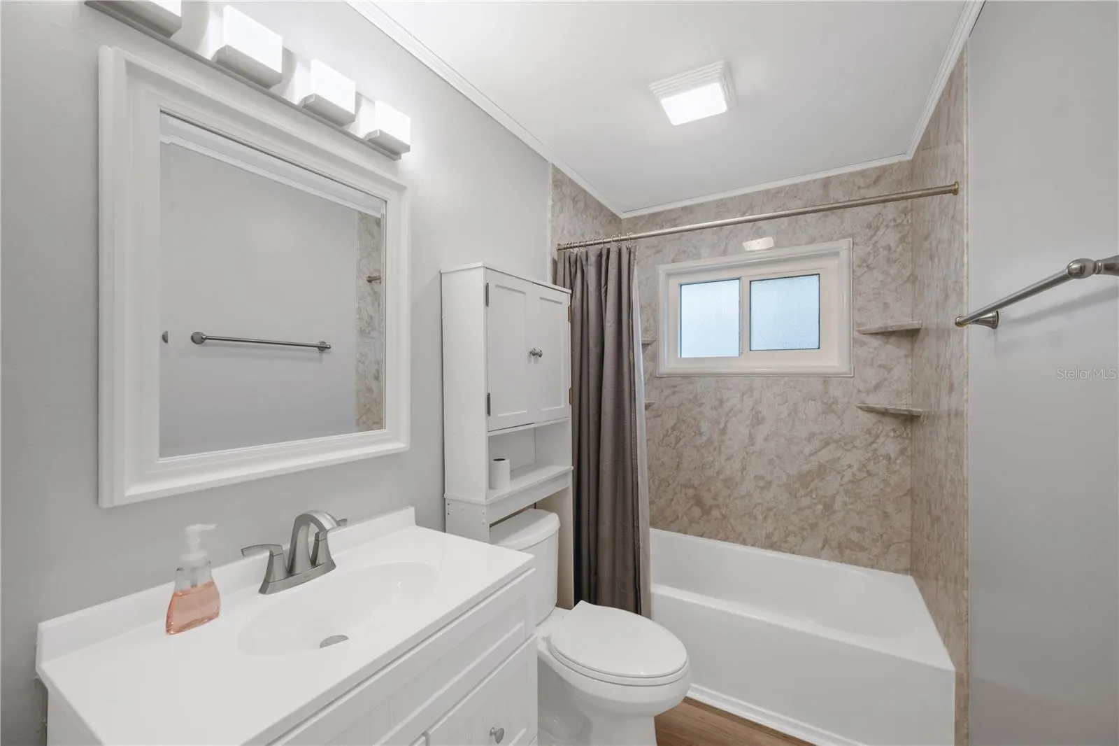 Upstairs shared 4-piece bathroom with a tub/shower was remodeled in 2023.combination.