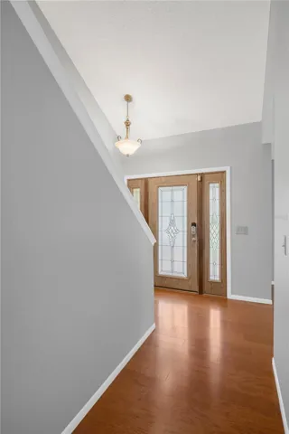 Step through the leaded glass front door with side lights into a 2-story foyer.