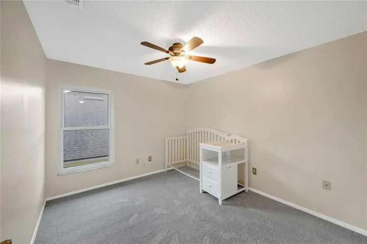 Bedroom #2 Has a walk-in closet, Updated carpet in 2023 and a ceiling fan.