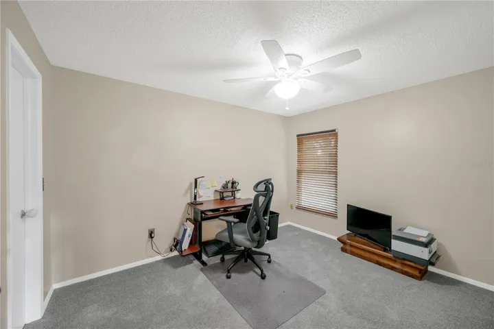Bedroom #2 Has a walk-in closet, Updated carpet in 2023 and a ceiling fan.
