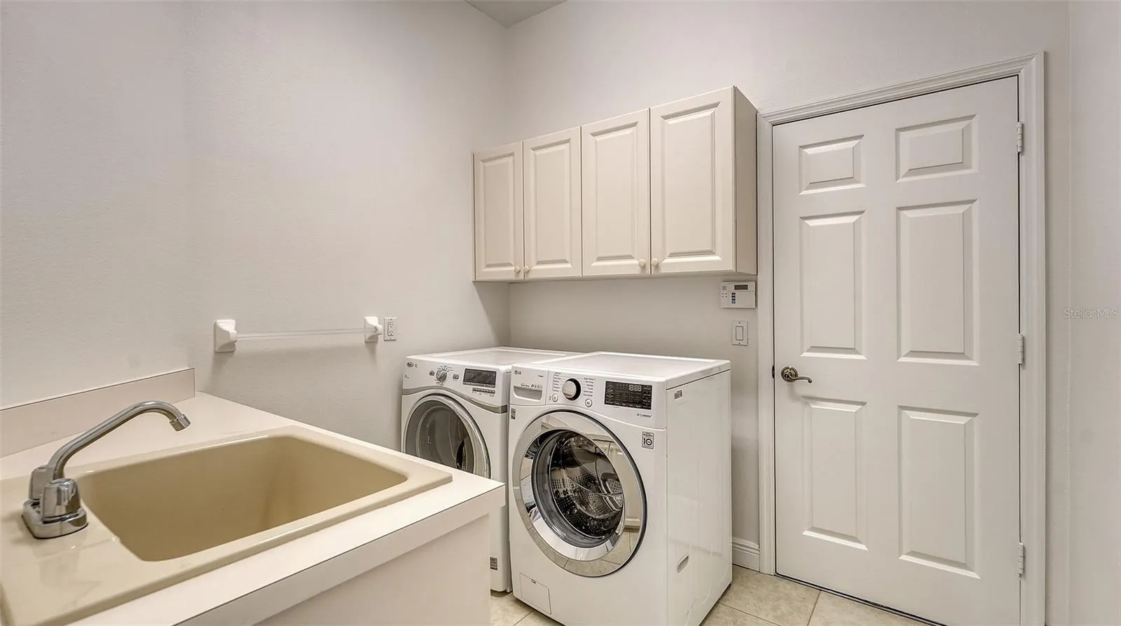 Laundry room with newer washer and dryer