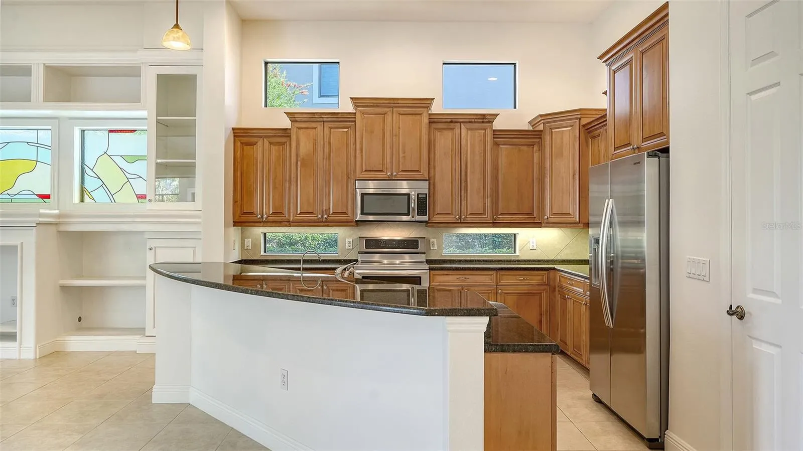 Spacious kitchen with newer appliances including an induction range.