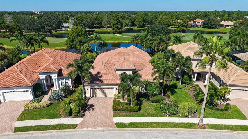 Set on a gorgeous lake and golf course view lot.