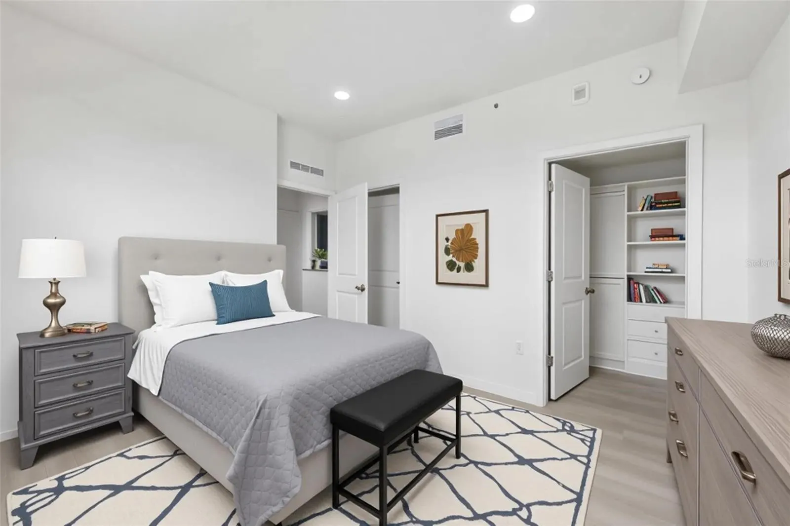 Primary bedroom with built-in closet