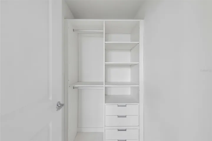 Primary bedroom with built-in closet