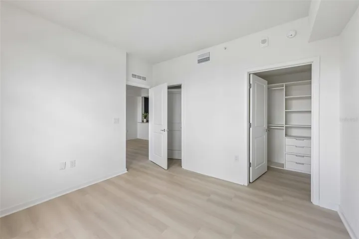 Primary bedroom with built-in closet