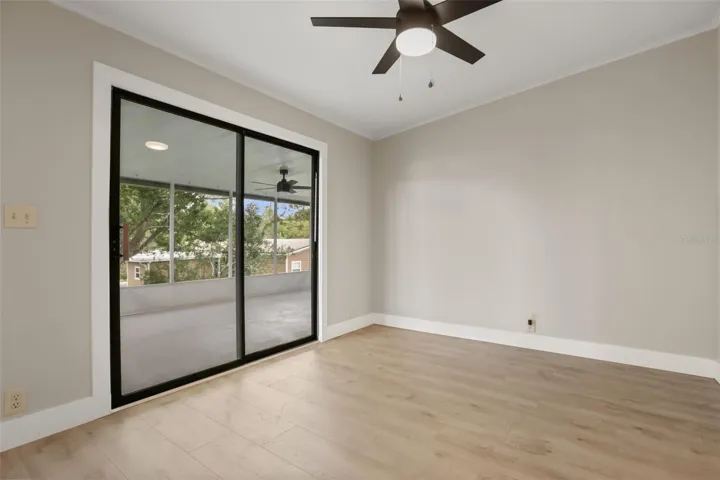 Bedroom 3 has access to the Screened Back Porch