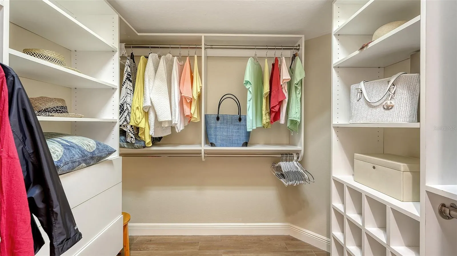 Spacious master closet with custom built in.