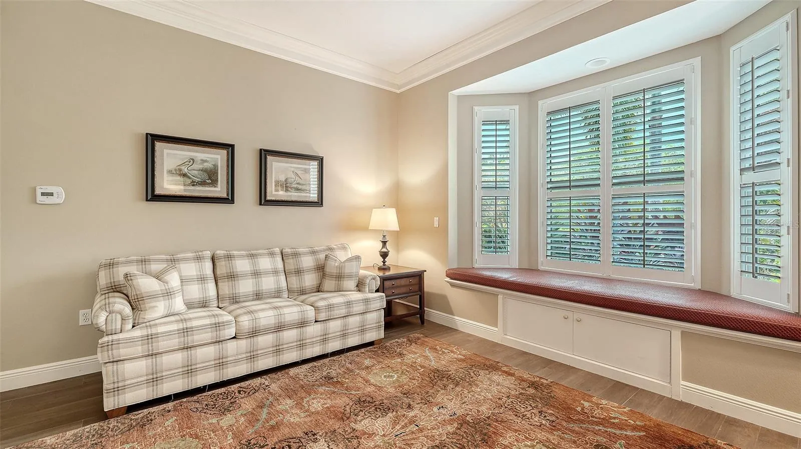 Guest bedroom #1 with a large bay window with storage
