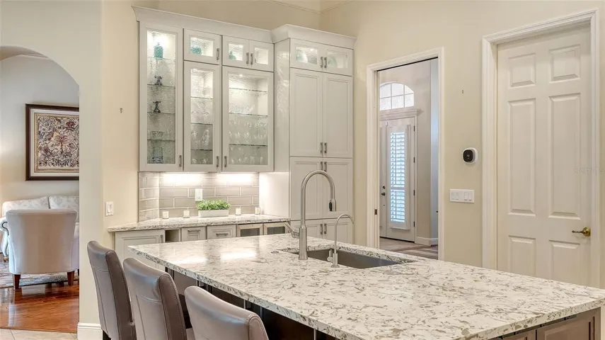 Large island with seating and storage with stunning Quartz countertops