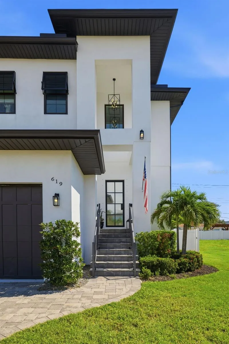 Built in 2020 with elevated living space and two floors of concrete block construction.