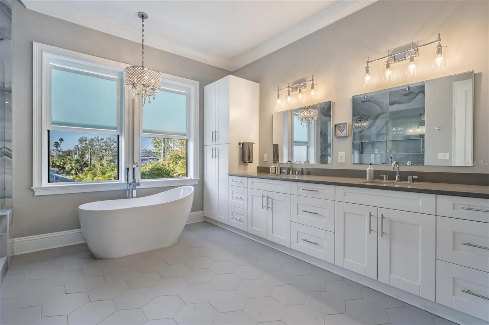Dual vanities and plenty of cabinets.