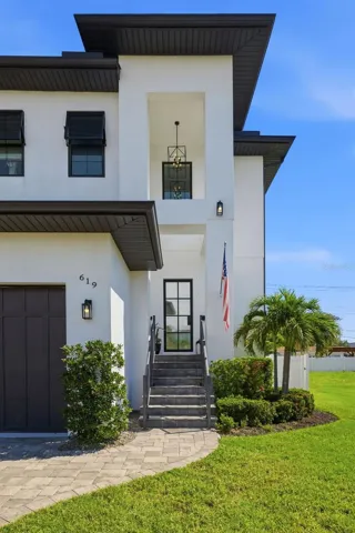 Built in 2020 with elevated living space and two floors of concrete block construction.