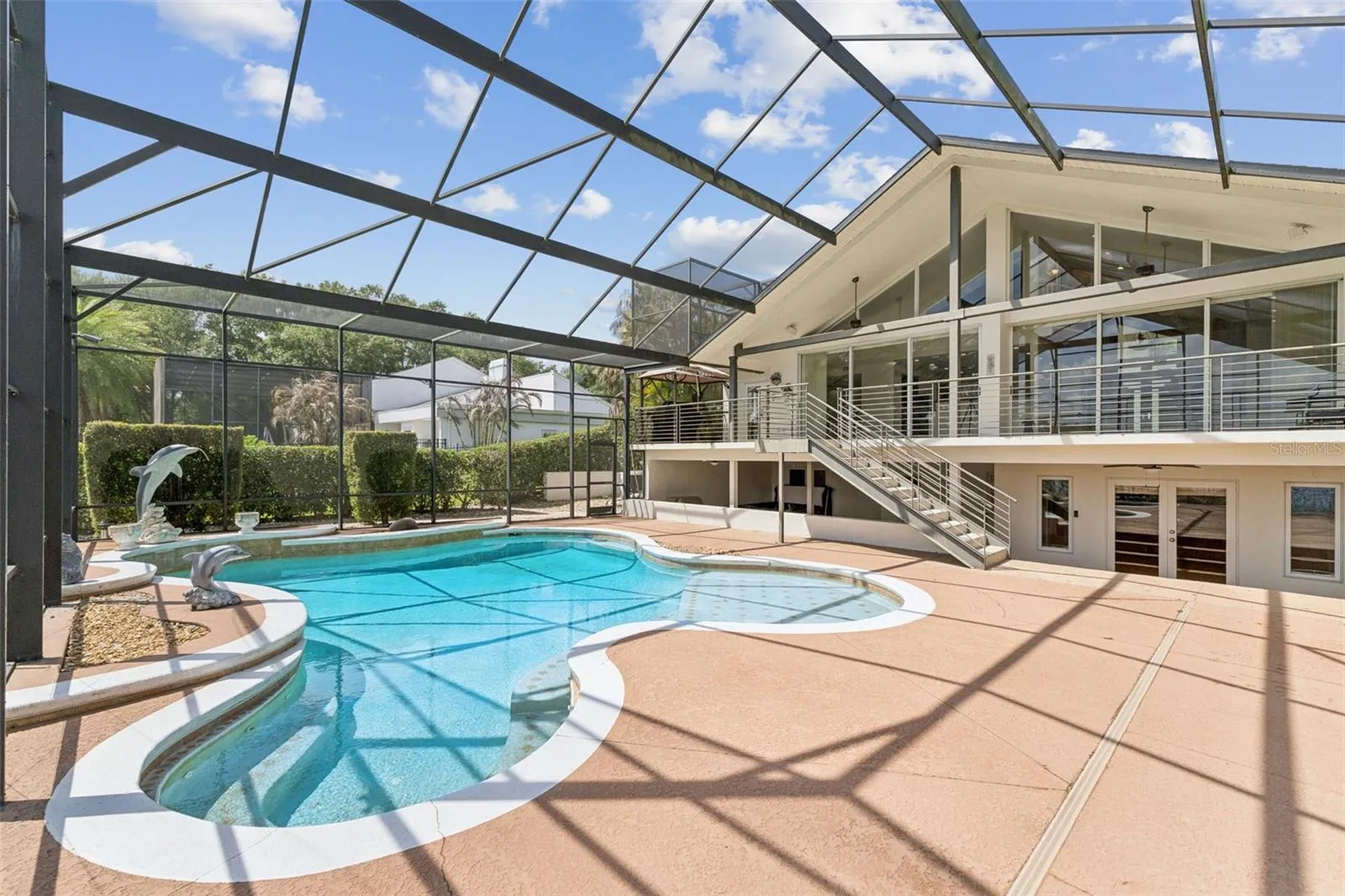 Screened pool, covered entertaining area.