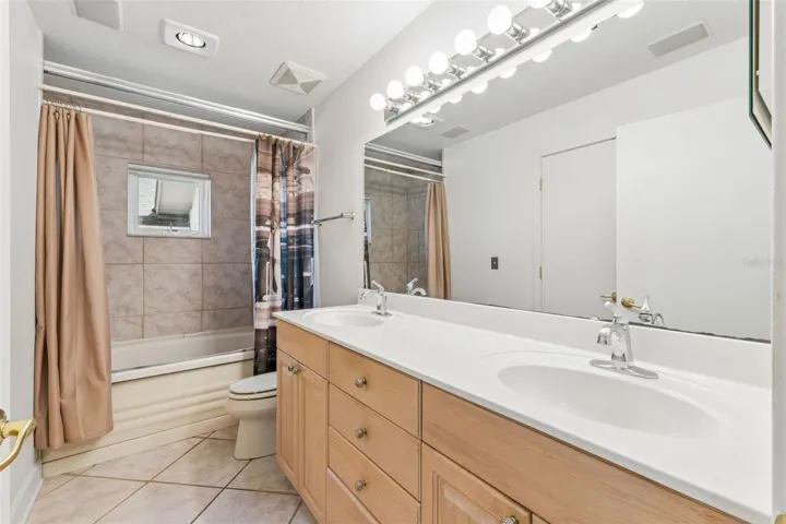 Full-size hallway bathroom serving the three first-level bedrooms.