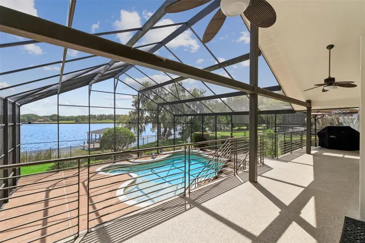 Outdoor features include a screened pool, covered entertaining area, fenced yard.