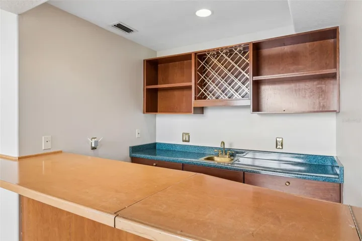 Built-in wet bar connected to the sunken great room, perfect for entertaining.