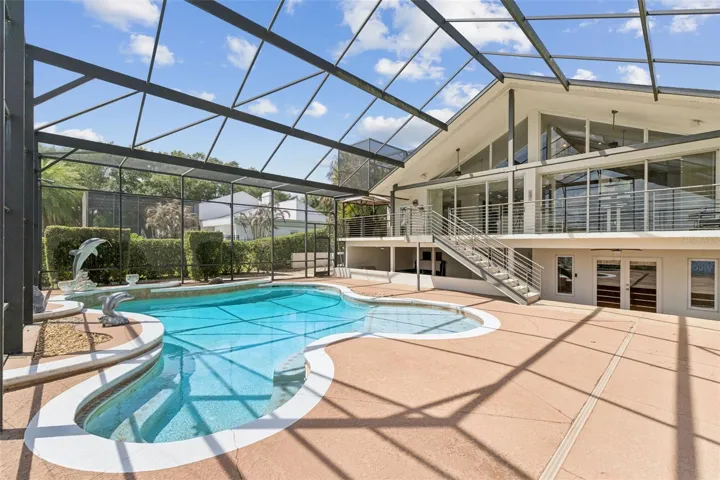 Screened pool, covered entertaining area.
