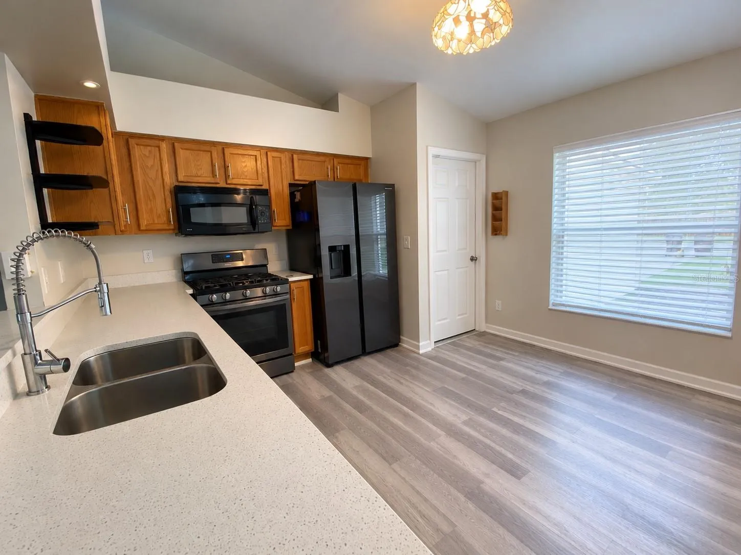 kitchen open to living area Solid counters Appliances included
