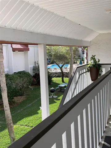 View from front porch with pool only 25 steps to the pool and 3 minutes to the beach.