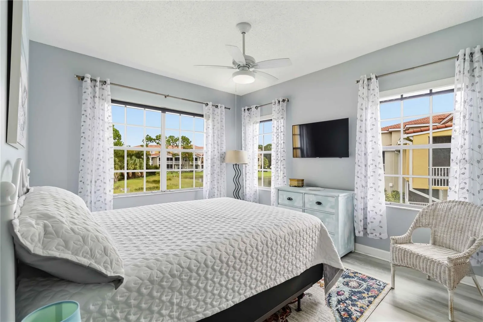 Spacious primary suite features remote-controlled blinds