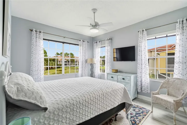 Spacious primary suite features remote-controlled blinds