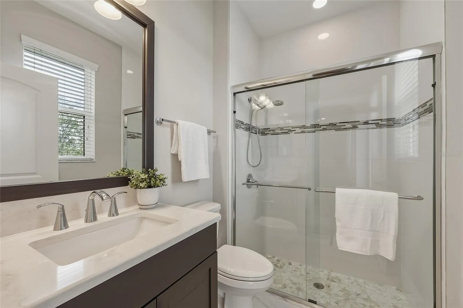 Full bath with walk in shower for guests on first floor