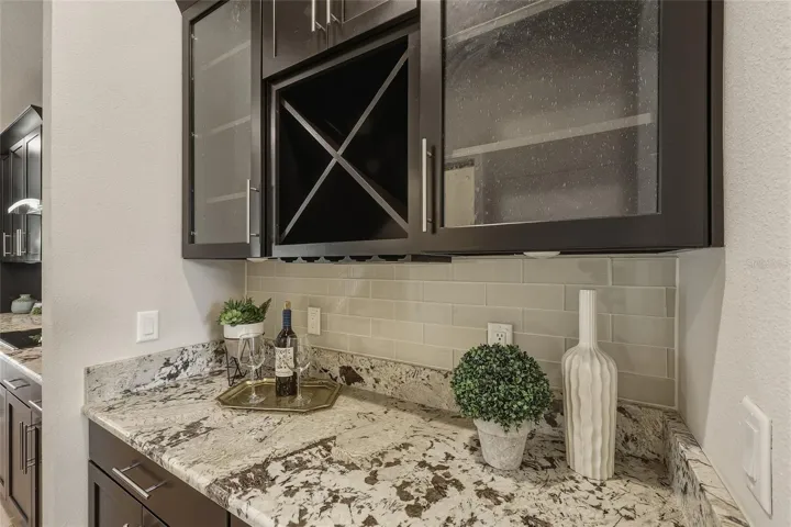 Butler's pantry with built-in wine storage and glass-front cabinetry