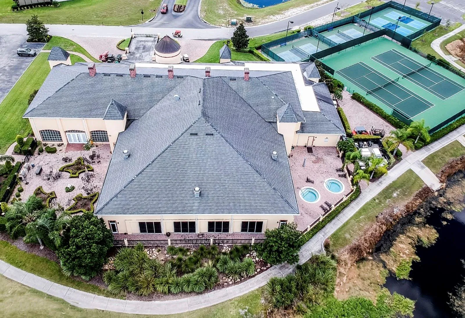 The rear of the Health and Fitness Center is dominated by the indoor pool. The rose garden is on the left and the spa patio is on the right.