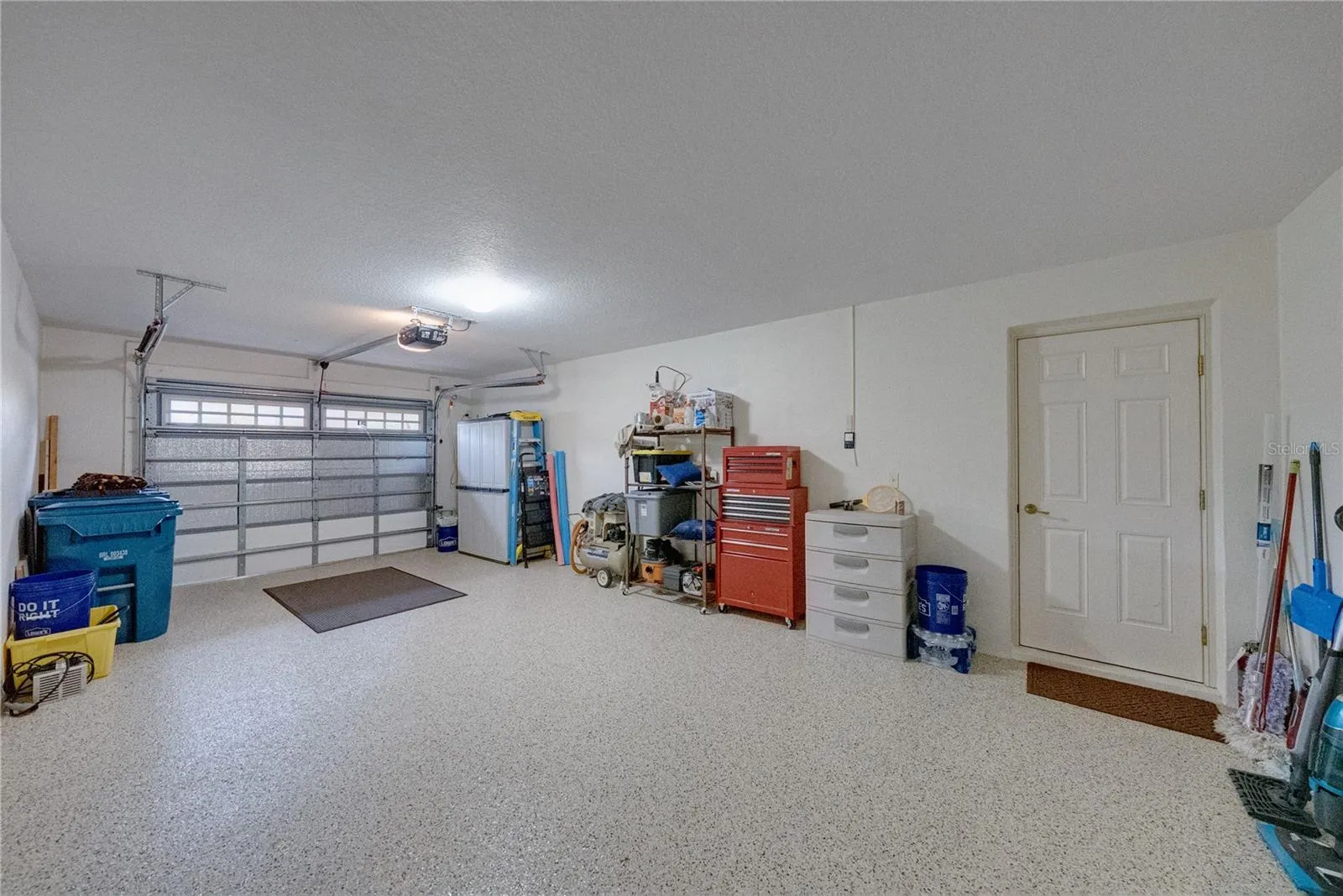 The extra deep garage has a pebble epoxy floor.