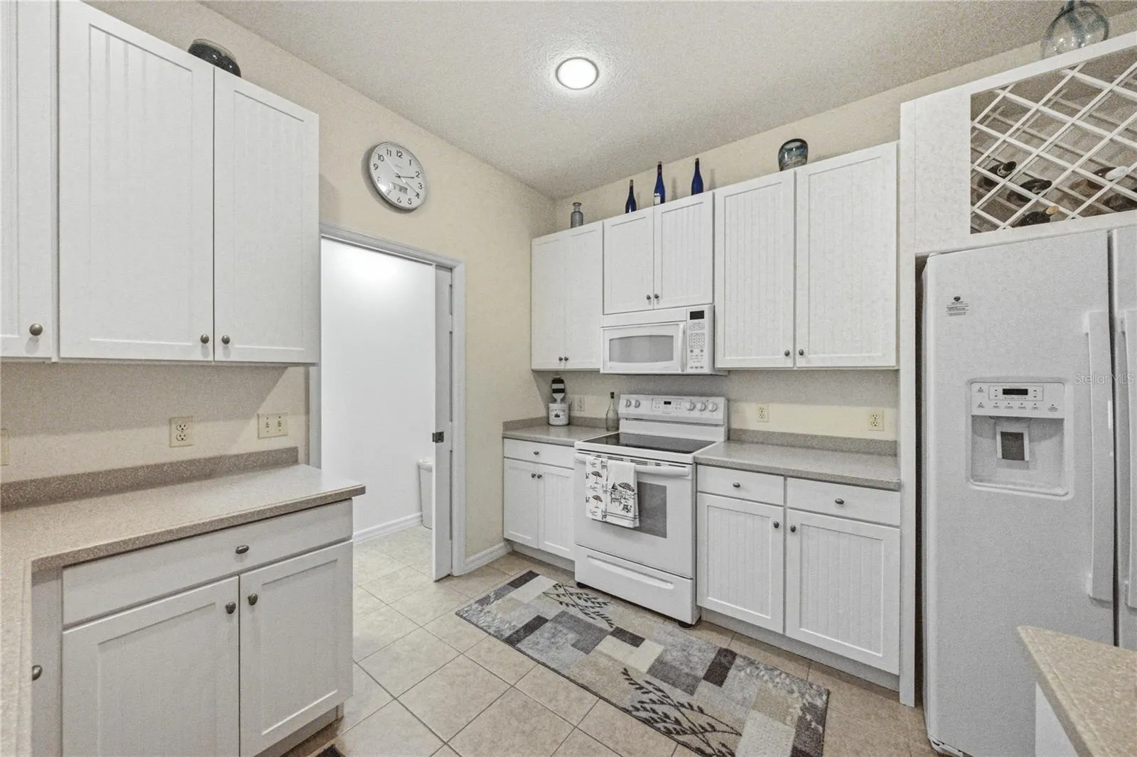 The inside laundry/storage room can be closed off from the kitchen by a handy pocket door.