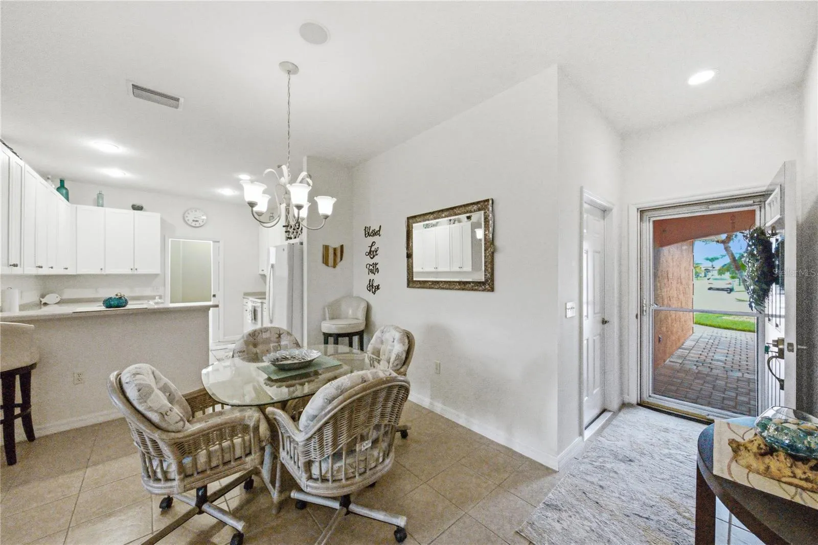 The welcoming foyer has the door to the attached extra deep garage.