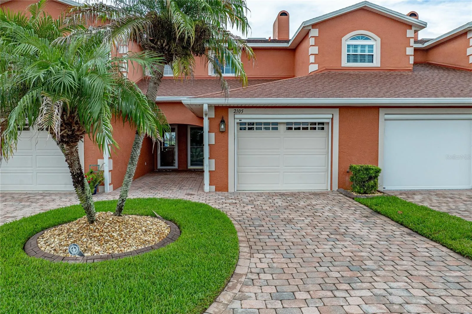 This lower-level condo has 2 bedrooms and 2 baths. The garage has a powered roll-up garage door screen.