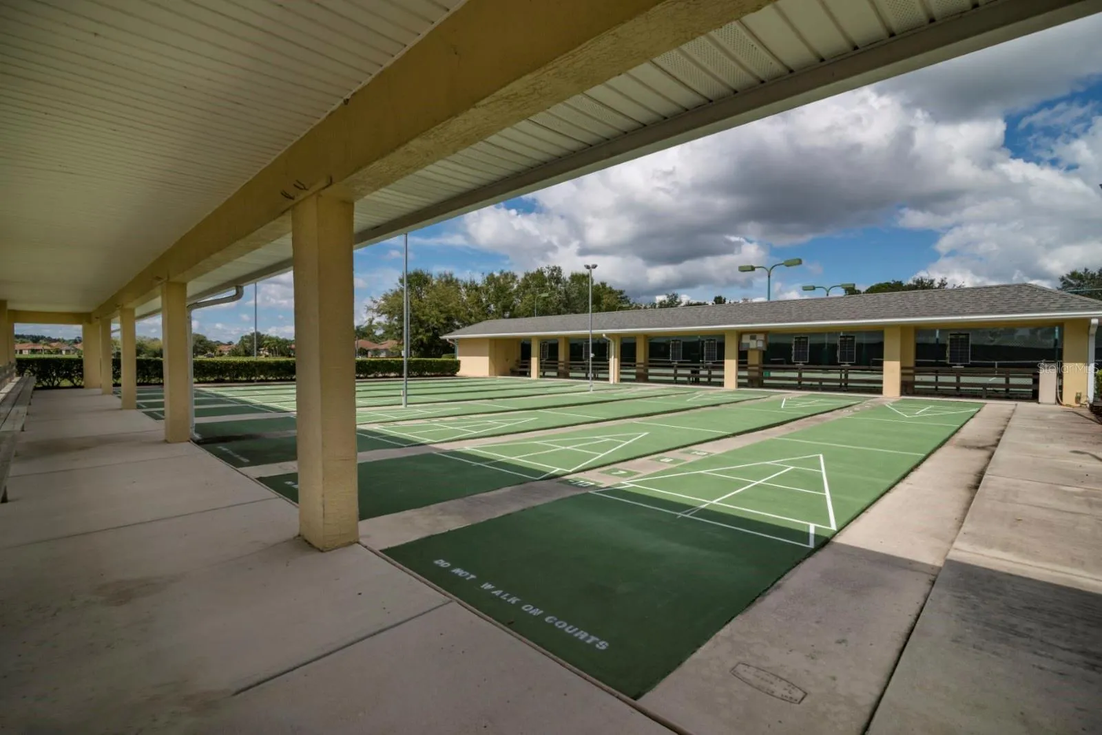 The lighted shuffleboard courts are on the main clubhouse grounds.