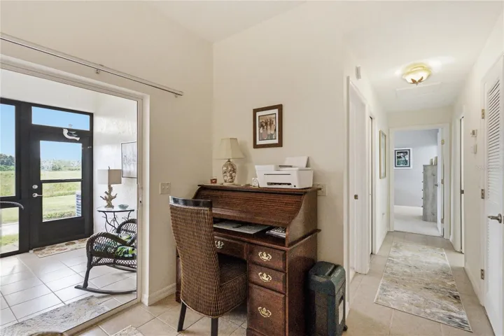 The hallway has the guest bedroom and linen closet on the left and the guest bath on the right.