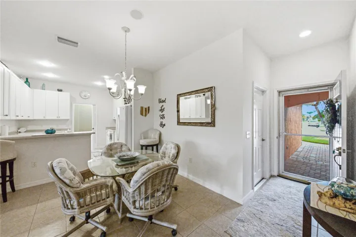 The welcoming foyer has the door to the attached extra deep garage.